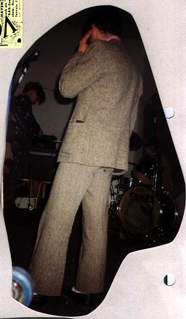 Musician in old fashioned suit,
onstage